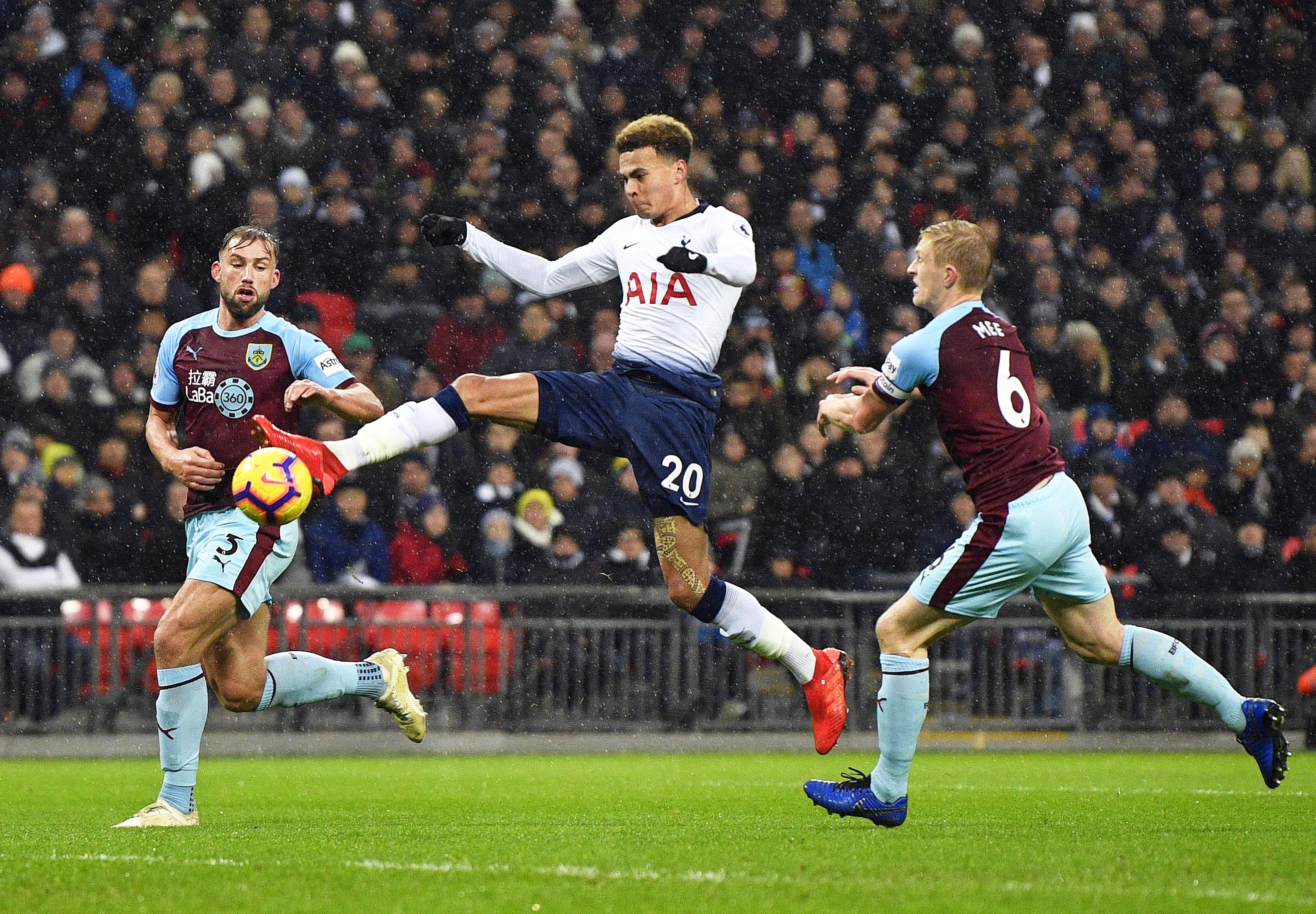 epa07233527 Tottenham's Dele Alli (C) in action during the English Premier League soccer match between Tottenham Hotspur and Burnley FC at Wembley in London, Britain, 15 December 2018. EPA-EFE/NEIL HALL EDITORIAL USE ONLY. No use with unauthorized audio, video, data, fixture lists, club/league logos or 'live' services. Online in-match use limited to 120 images, no video emulation. No use in betting, games or single club/league/player publications.