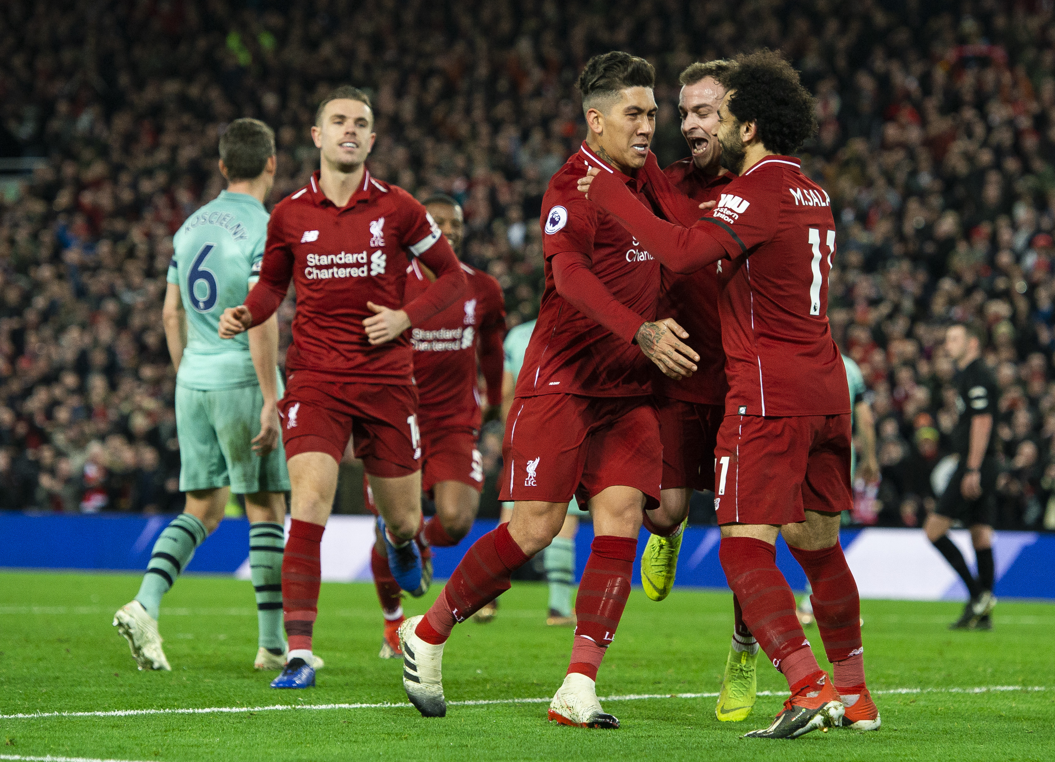 epa07253384 Liverpool's Roberto Firmino celebrates scoring the sixth goal making the score 5-1 during the English Premier League soccer match between Liverpool and Arsenal at the Anfield in Liverpool, Britain, 29 December 2018. EPA-EFE/PETER POWELL EDITORIAL USE ONLY. No use with unauthorized audio, video, data, fixture lists, club/league logos or 'live' services. Online in-match use limited to 120 images, no video emulation. No use in betting, games or single club/league/player publications