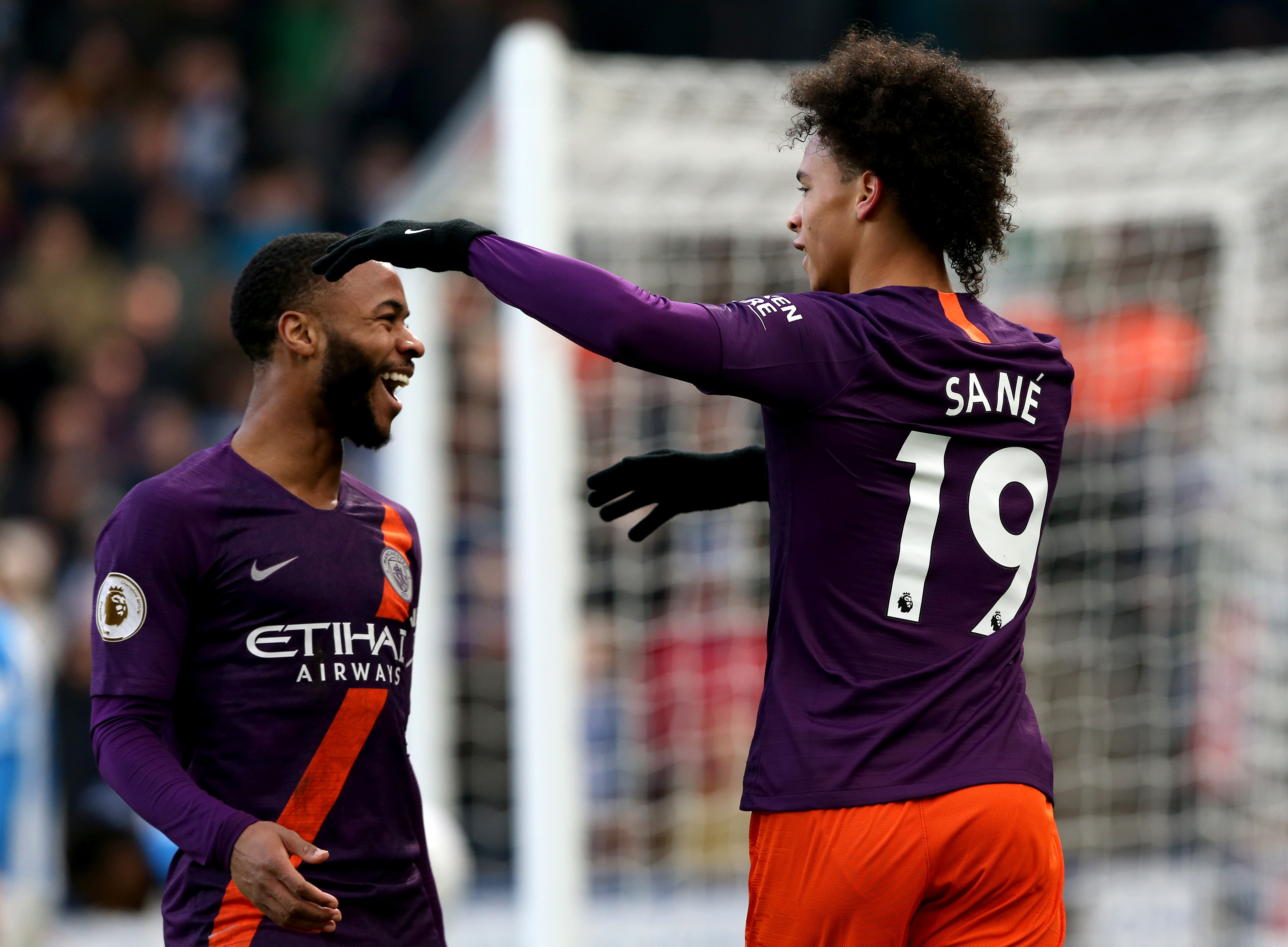 epa07303571 Manchester City's Leroy Sane (R) celebrates scoring with team mate Raheem Sterling during the English Premier League soccer match between Huddersfield Town and Manchester City at the John Smith's Stadium in Huddersfield, Britain, 20 January 2019. EPA-EFE/NIGEL RODDIS EDITORIAL USE ONLY. No use with unauthorized audio, video, data, fixture lists, club/league logos or 'live' services. Online in-match use limited to 120 images, no video emulation. No use in betting, games or single club/league/player publications.