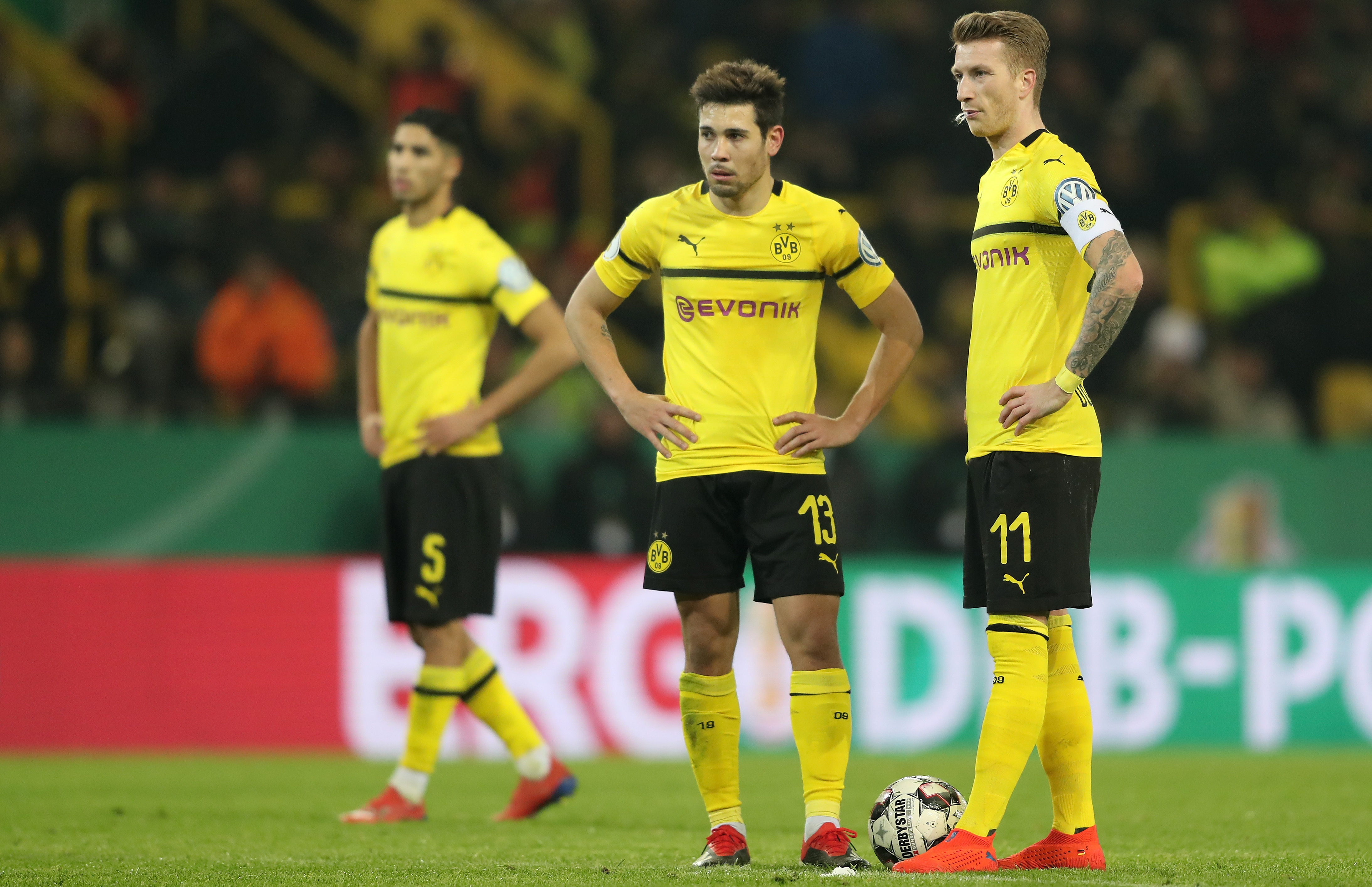 epa07346256 (L-R) Dortmund's Achraf Hakimi, Dortmund's Raphael Guerreiro and Dortmund's Marco Reus look on during the German DFB Cup third round soccer match between Borussia Dortmund and SV Werder Bremen in Dortmund, Germany, 05 February 2019.
(ATTENTION: The DFB prohibits the utilisation and publication of sequential pictures on the internet and other online media during the match (including half-time). ATTENTION: BLOCKING PERIOD! The DFB permits the further utilisation and publication of the pictures for mobile services (especially MMS) and for DVB-H and DMB only after the end of the match.) EPA-EFE/FRIEDEMANN VOGEL